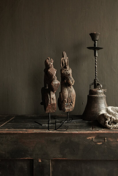 Beautiful antique wooden horse on an iron stand