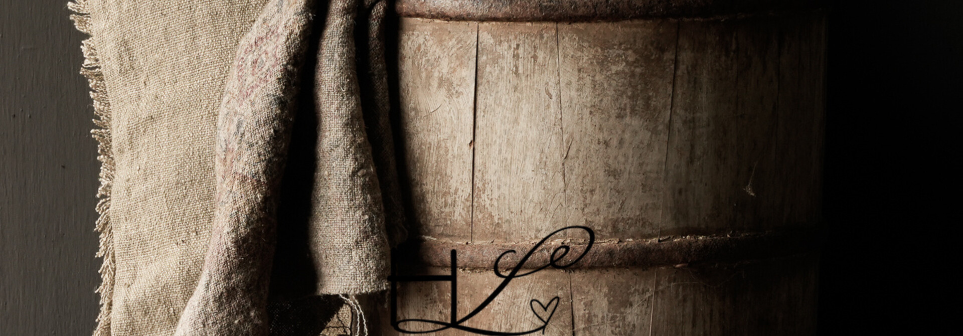 Authentic old wooden bucket with iron handle