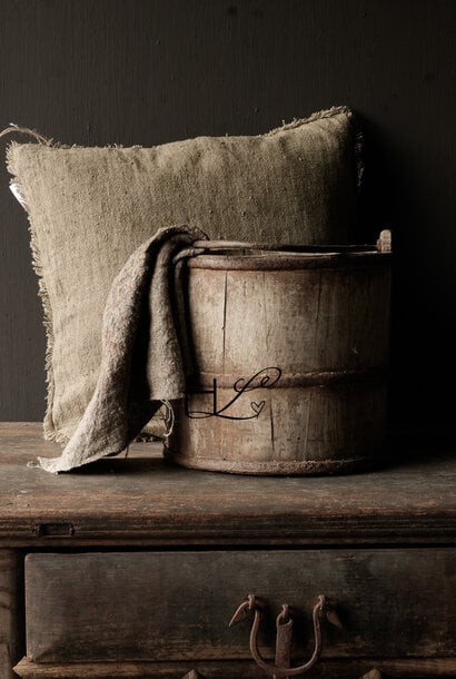 Authentic old wooden bucket with iron handle