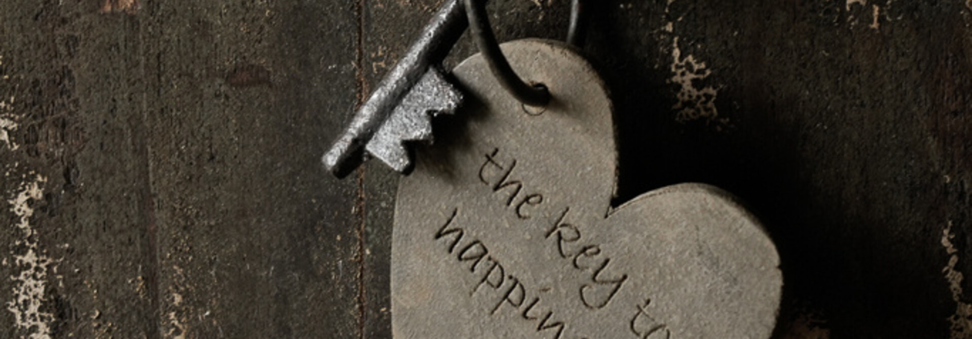 Schlüsselanhänger mit Text „Der Schlüssel zum Glück“.