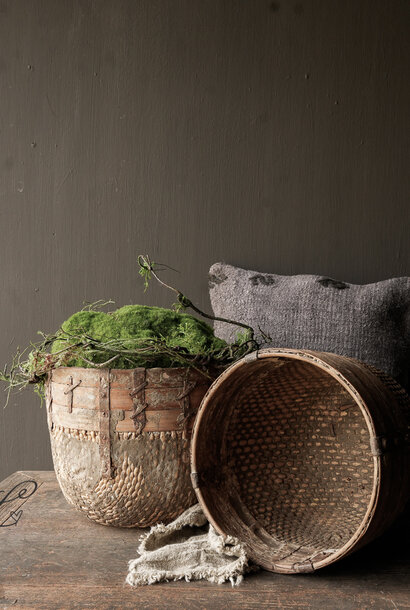 Old authentic wicker basket with wooden edge