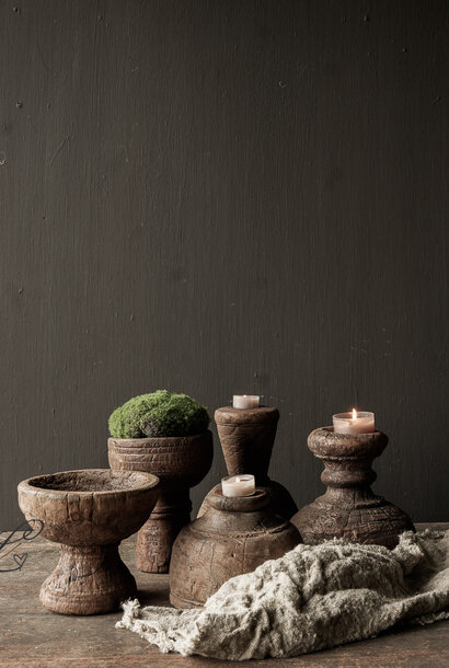 Tough rustic old wooden candlestick