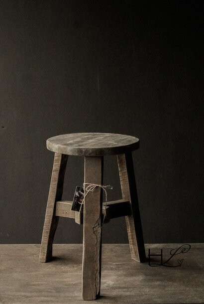 Round old wooden stool