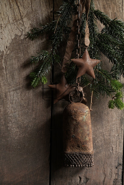 Beautiful rust brown iron bell with stars