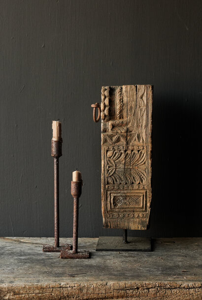 Old Unique wooden ornament on iron base