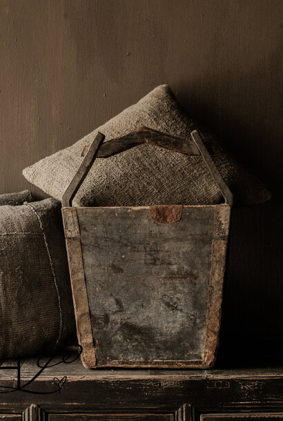 Old dark wooden basket with handle