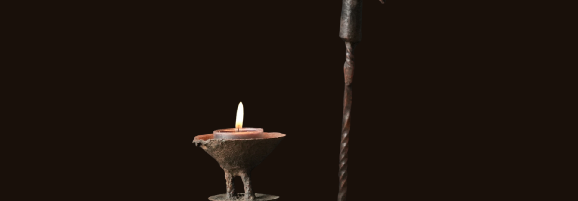 Iron imperfect antique candlestick