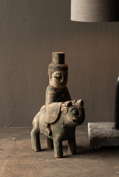 Antique wooden votive statue – figure on animal