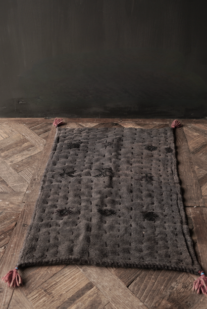 Unique sturdy black thin mattress made from an old used Indian Carpet
