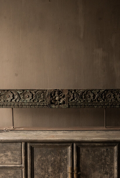 authentic wooden ornament on iron base