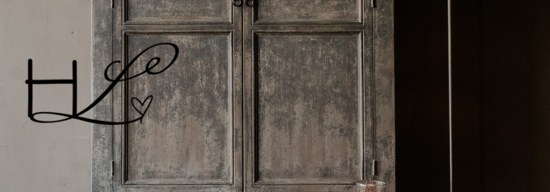 Tall, sturdy, rural, old wooden two-door cabinet on legs – Luksa