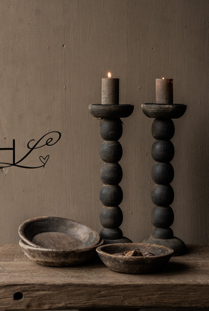 Sturdy old weathered rustic wooden candlestick