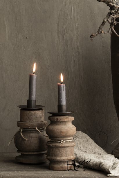 Small wooden candlestick made of old ornament