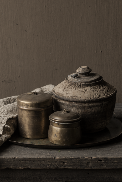 Small antique copper pot with lid
