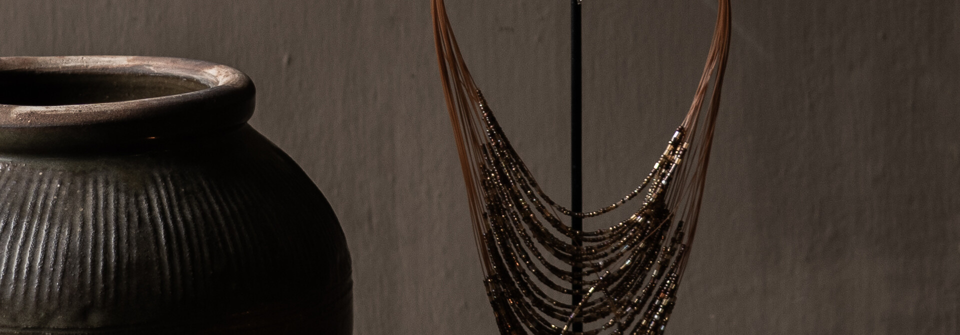 Decorative bead necklace on a stand