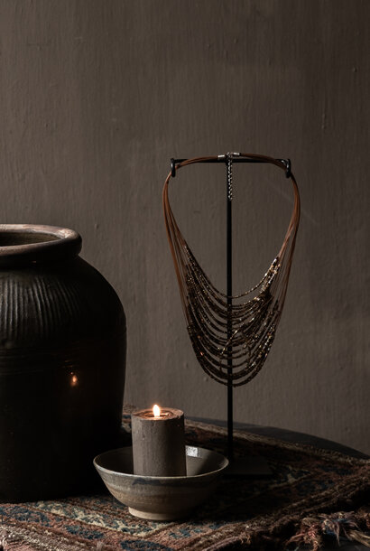 Decorative bead necklace on a stand