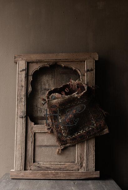 Sturdy wooden shutter from an old building in India