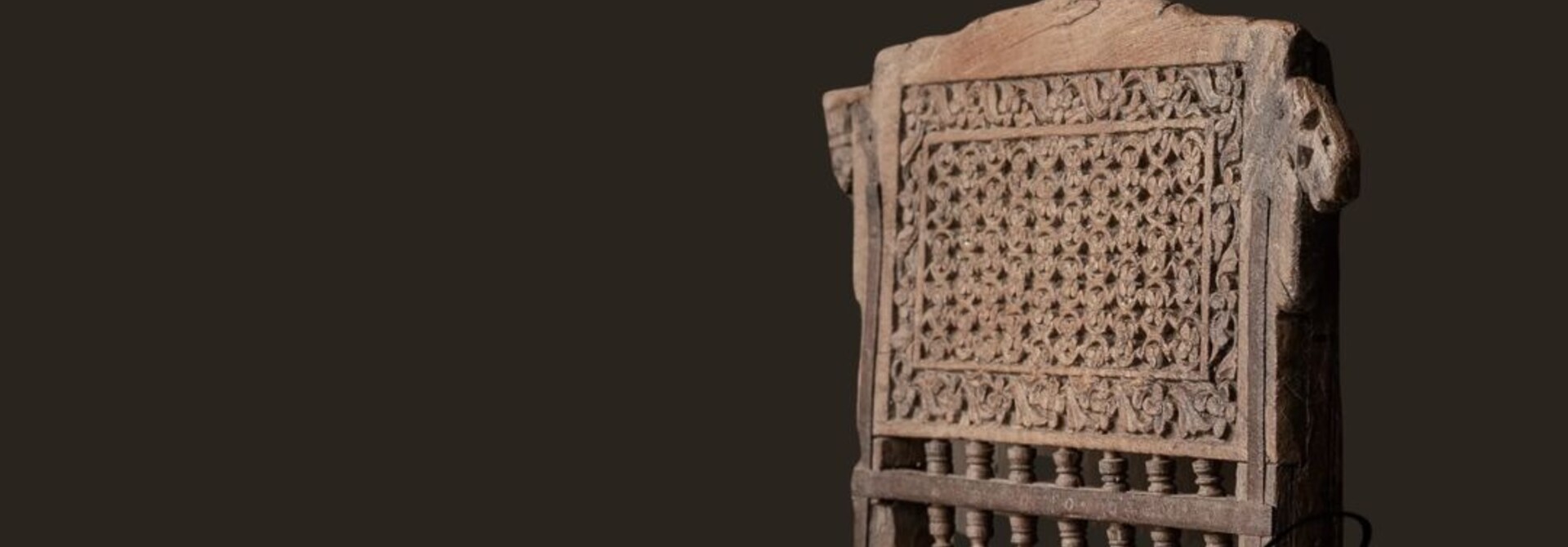 Unique antique low tribal chair with new seat