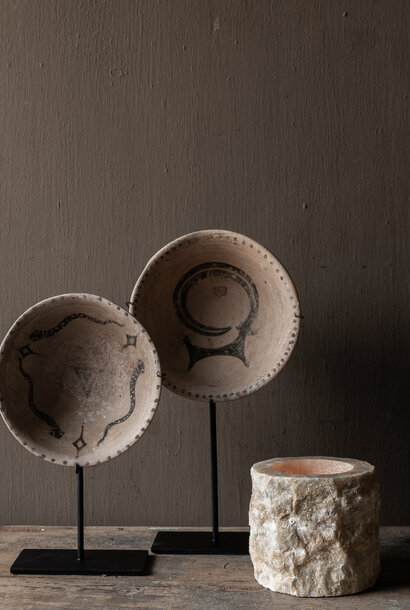 Authentic earthenware decorative bowl on a stand