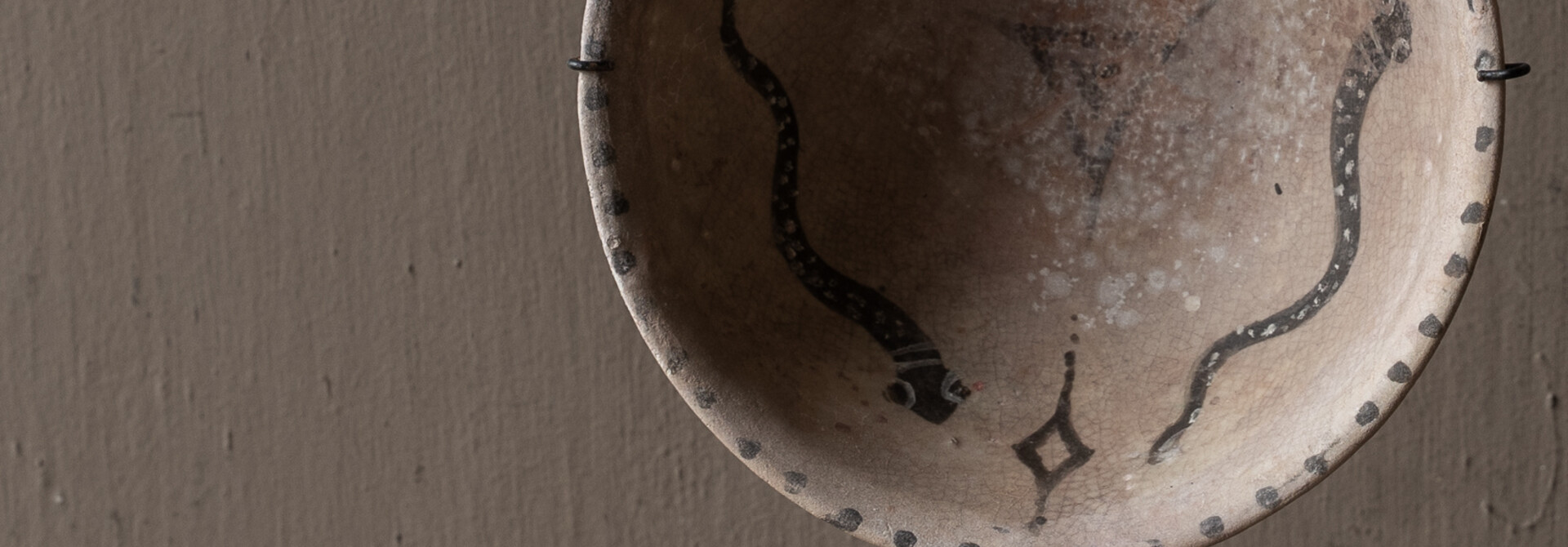 Authentic earthenware decorative bowl on a stand