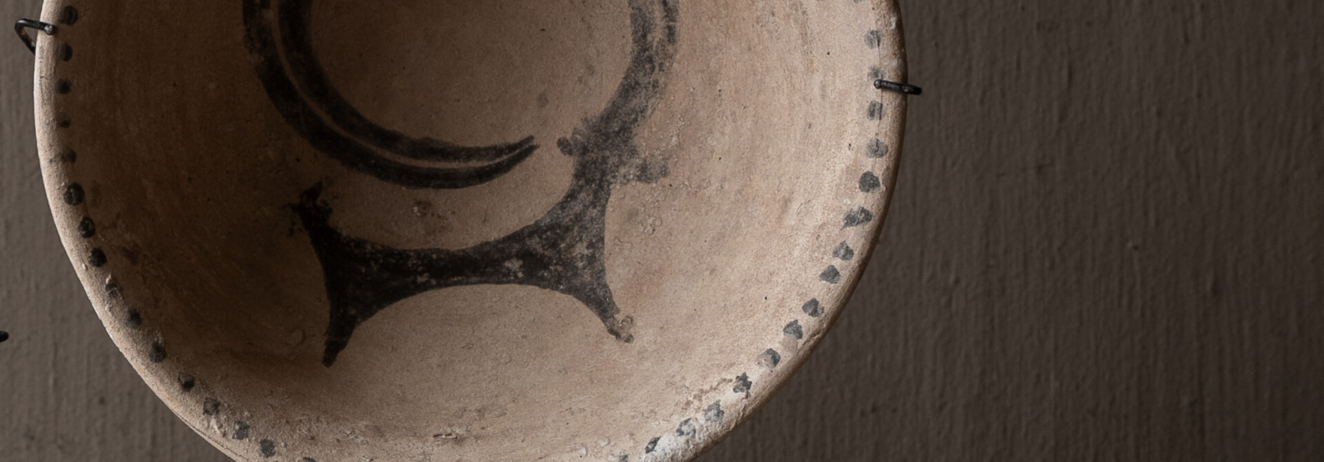 Authentic earthenware decorative bowl on a stand
