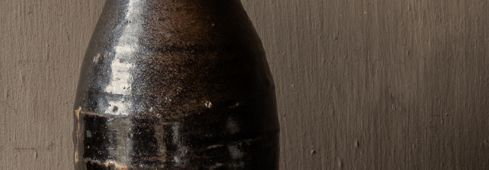 Authentic antique glazed earthenware rice wine bottle