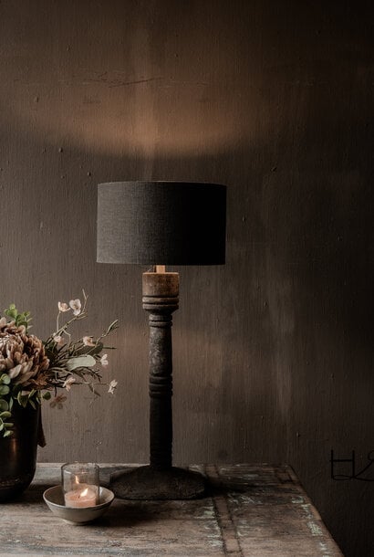 Slender wooden baluster lamp with a weathered look