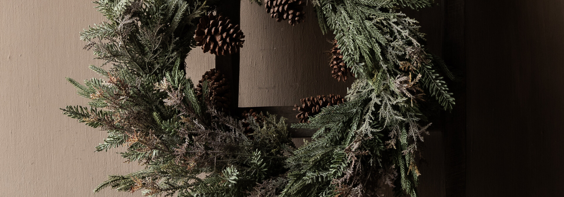 Winter wreath with fir branches & pine cones