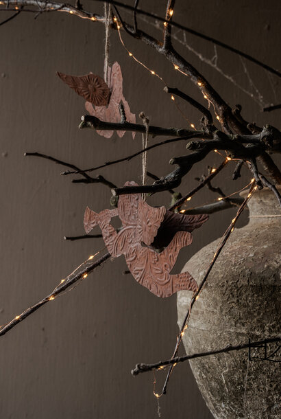 rusty iron hanging trumpet angel