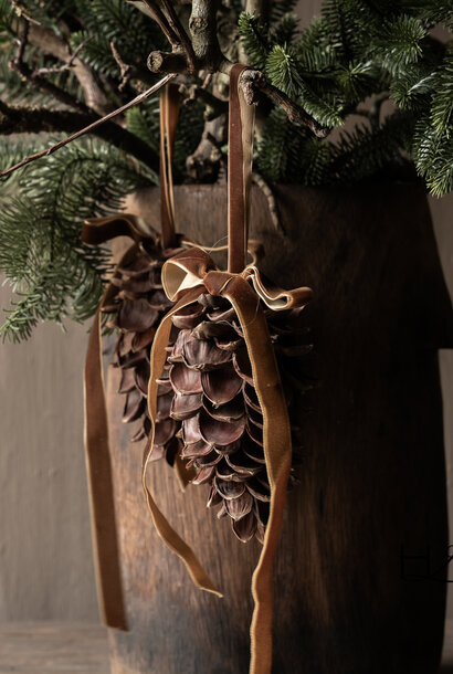 Decorative pine cone with brown velvet ribbon