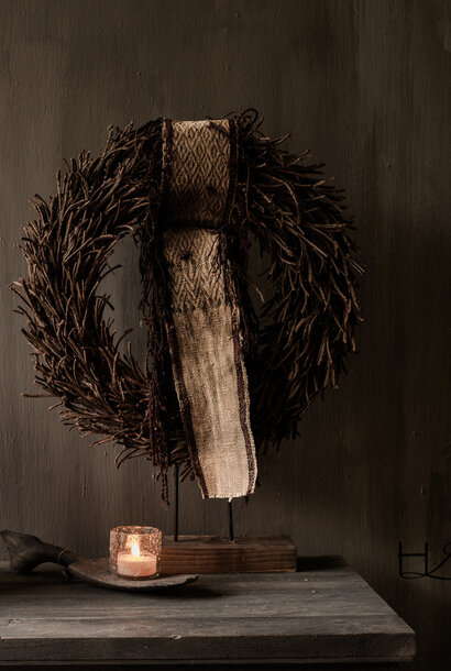 Rattan wreath on a wooden base