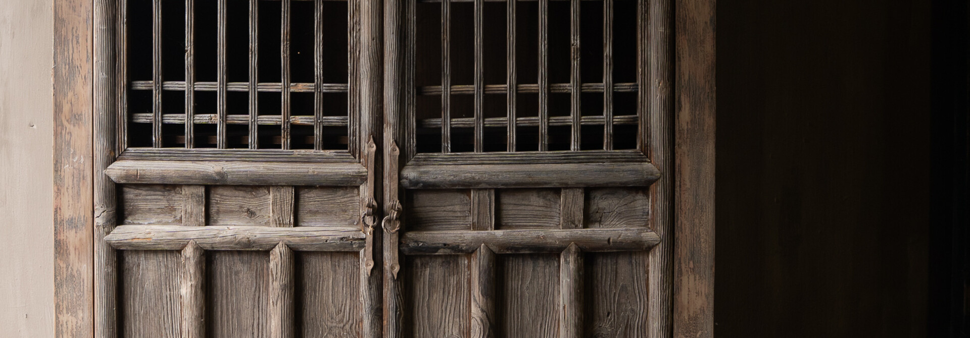 Antique wooden cabinet from India with lattice doors, wabi sabi & rustic.