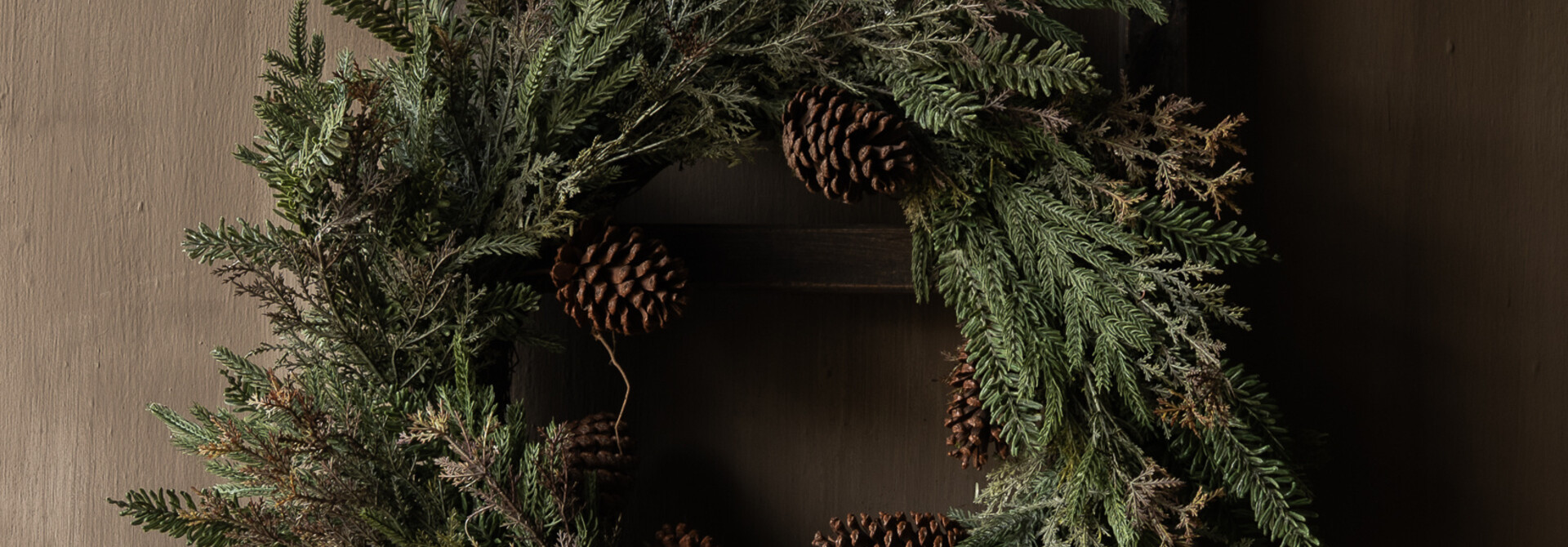 Winter wreath with fir greenery & pine cones, mixed cedar