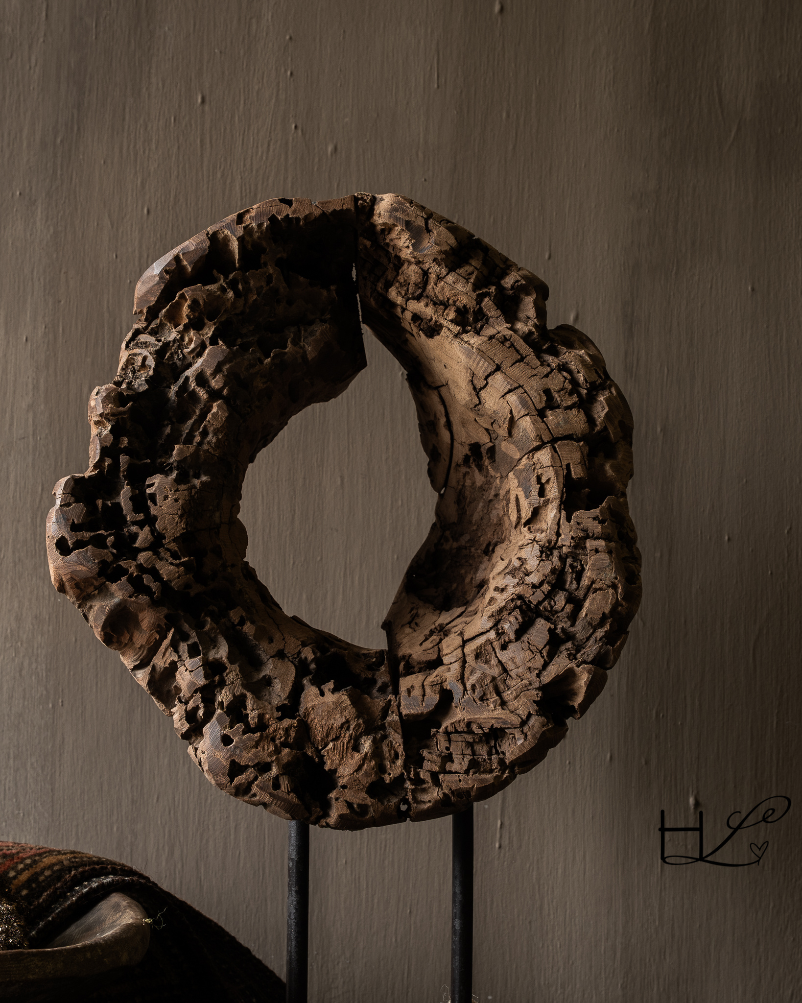 Round wooden ornament made of old wood on a base-2