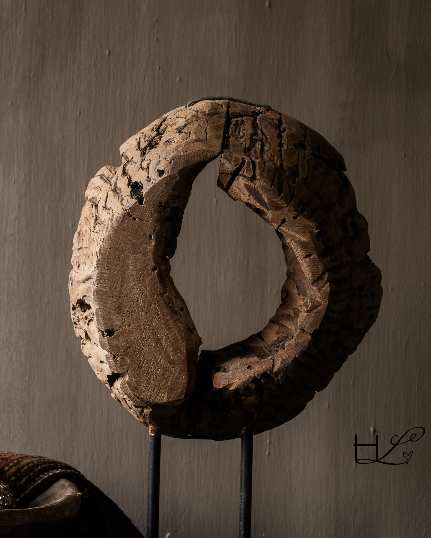 Round wooden ornament made of old wood on a base-3