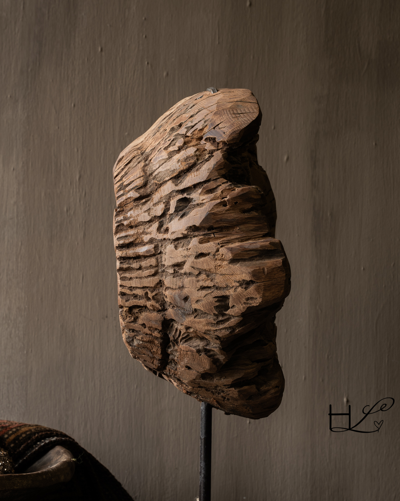 Round wooden ornament made of old wood on a base-4