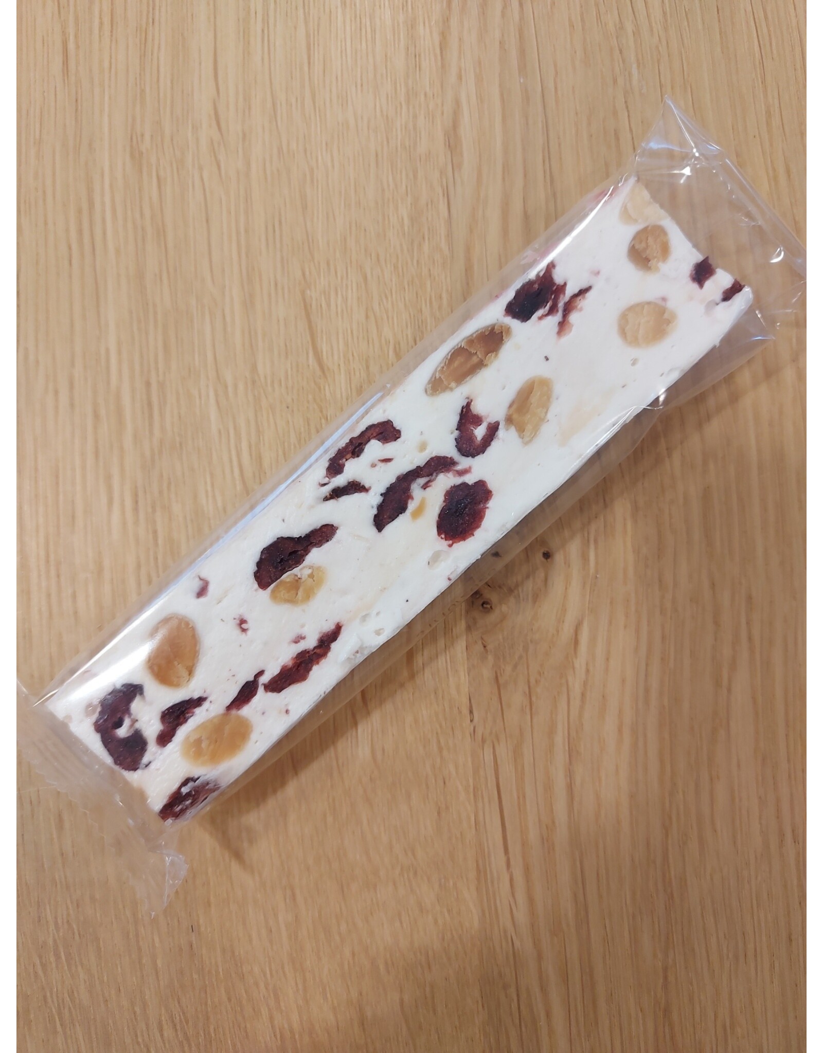 Nougatreep met amandel en cranberry 75 gr