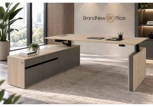 Motion Manager zit sta bureau met aanbouw