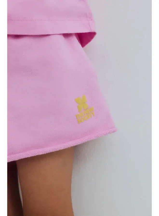 The New Society | tns logo short pink lavander