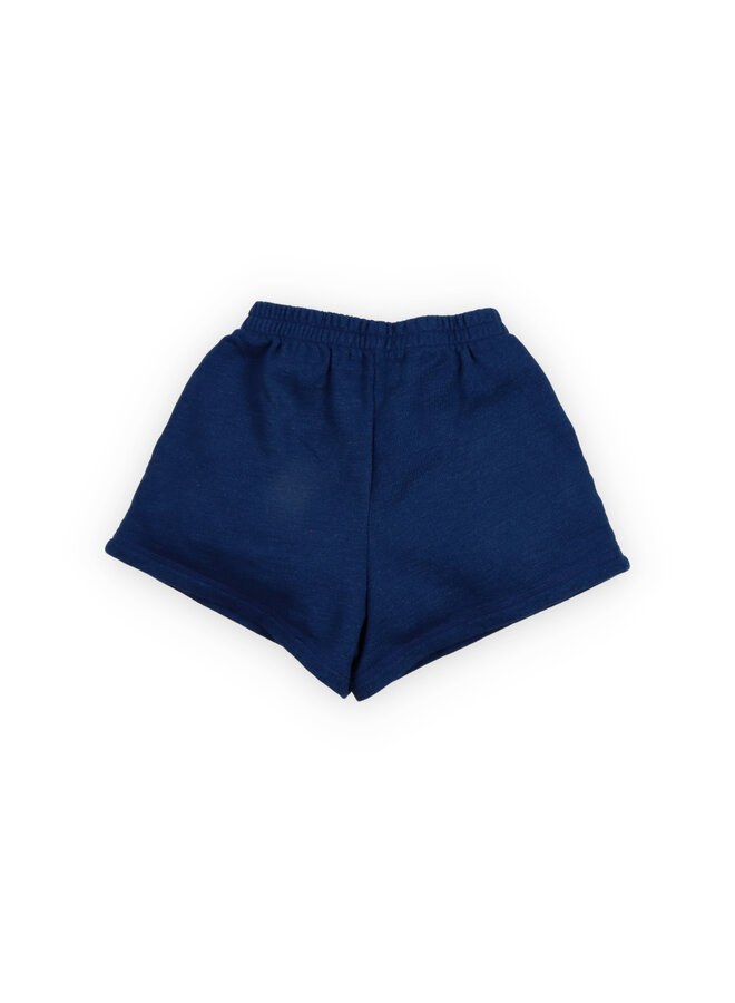 The New Society | tns logo short indigo denim