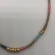 Biba  Ketting Biba goud mat/roze /blauw