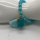 Biba  Armbandje Biba goud/aqua blauw