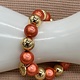 Biba  Armbandje Biba goud /oranje