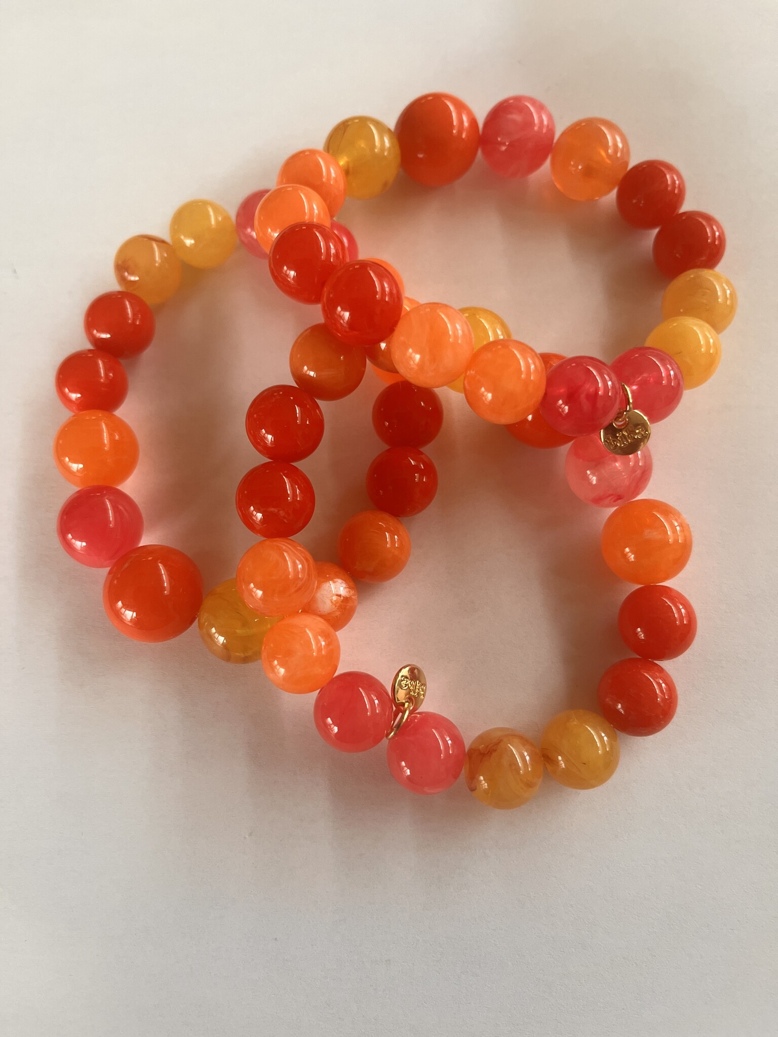 Biba  Armbandje Biba goud mix oranje roze