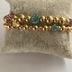 Biba  Armbandje Biba goud/paars/blauw/groen/roze/lila