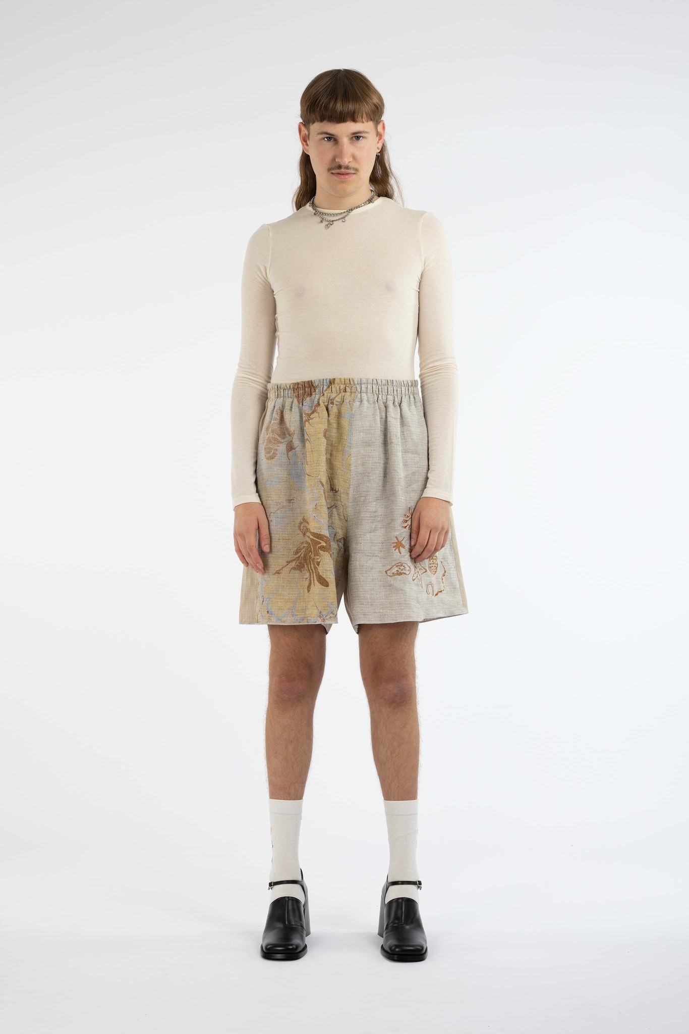 grey short with gathered sea things