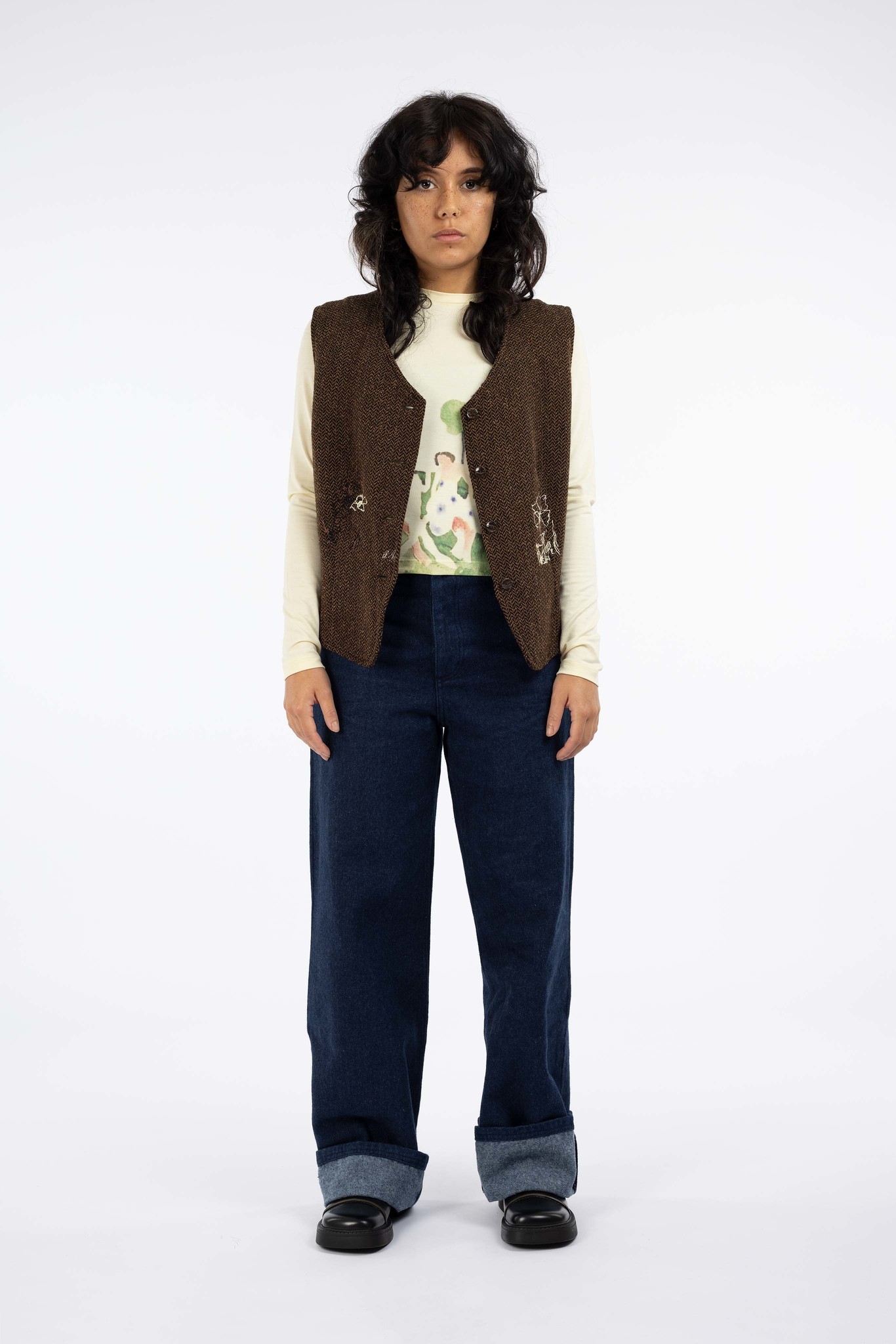 brown vest with flowers of every scene