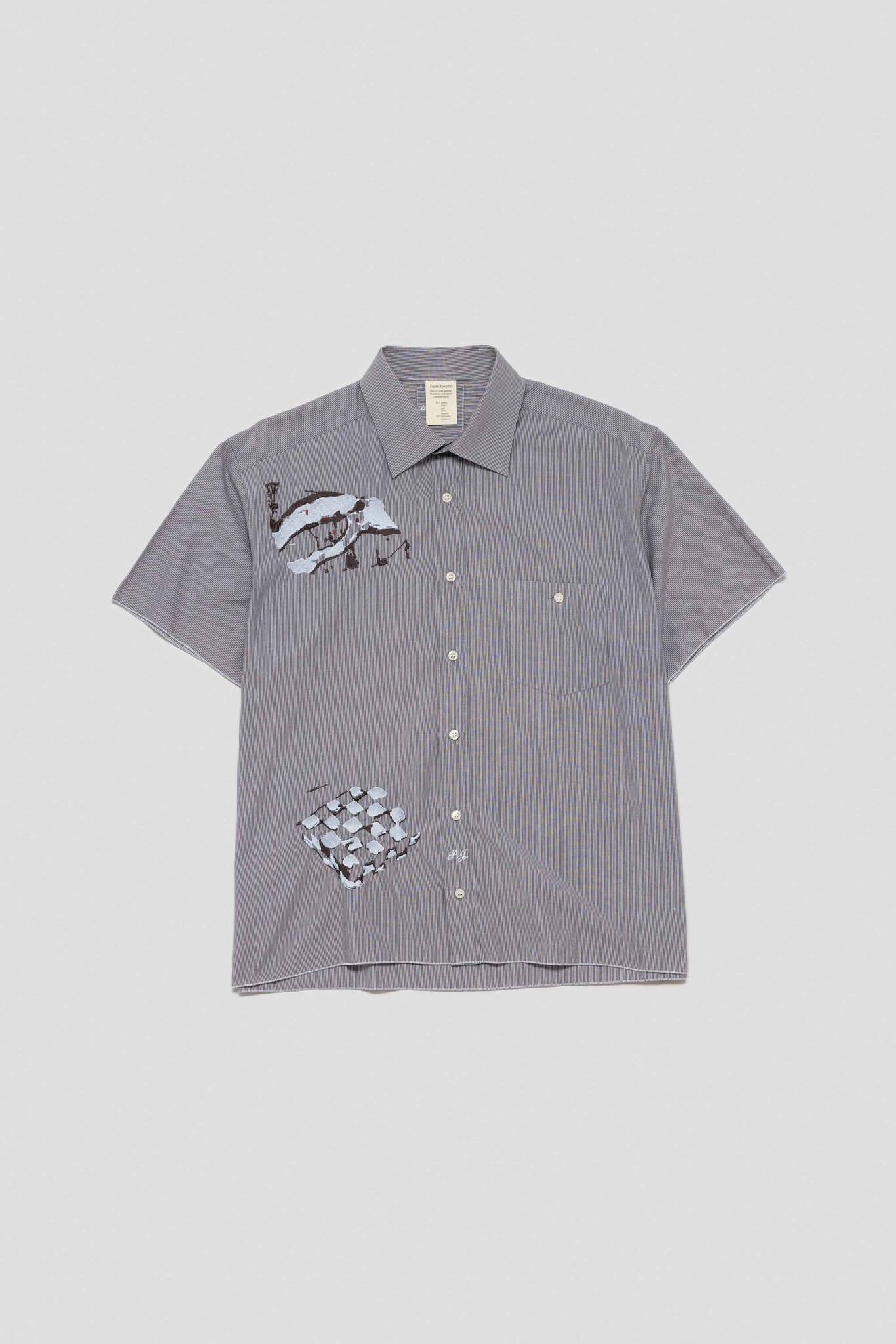 grey shirt with cracks of rocks