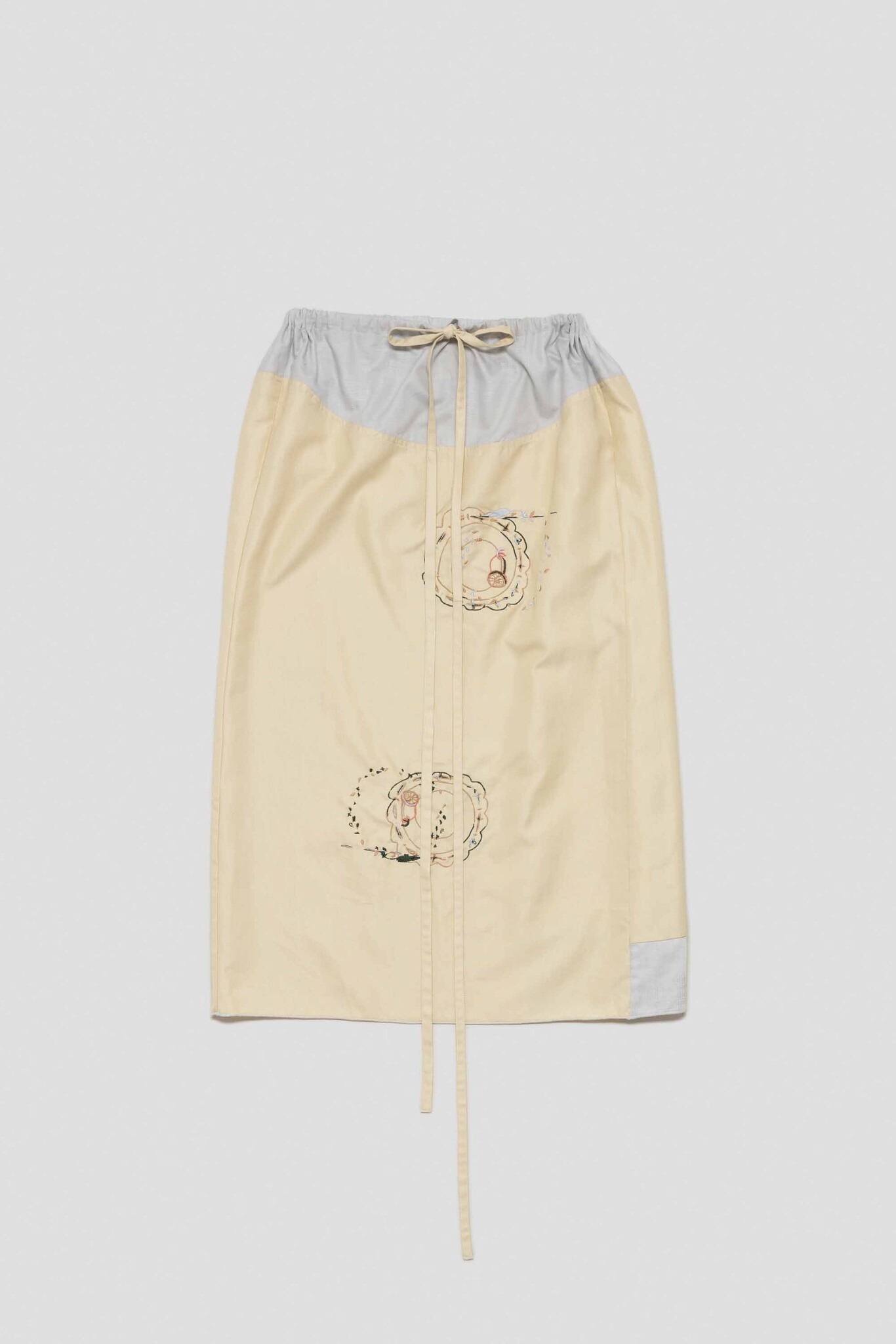 pale yellow skirt with summer citrus plates