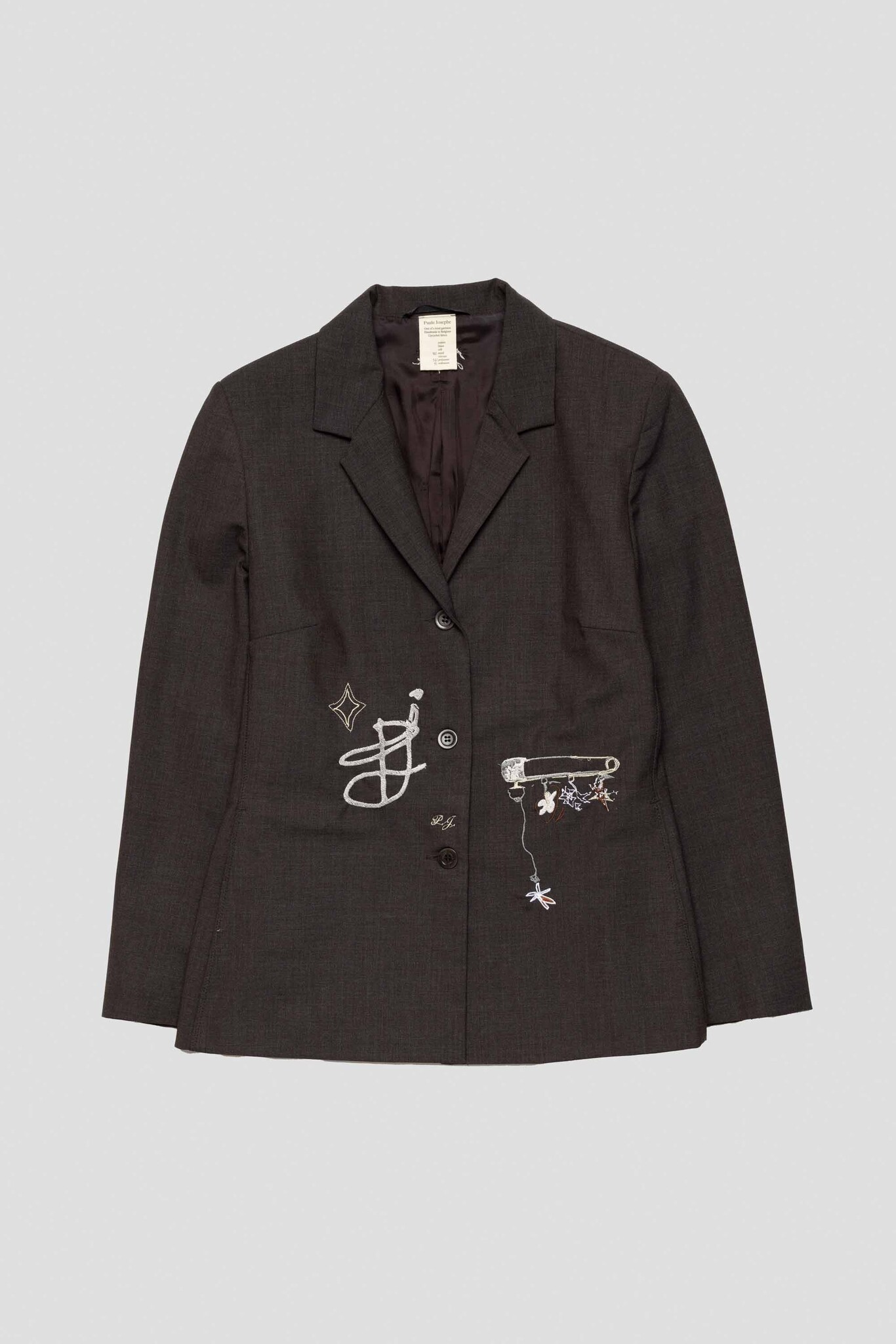 brown suit with PJ safety pins